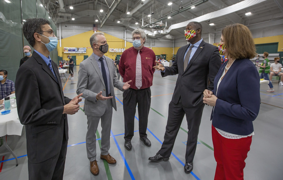 Calvin Ball with other officials at vaccine clinic