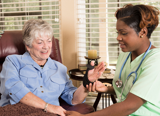 Senior woman receiving care from nurse