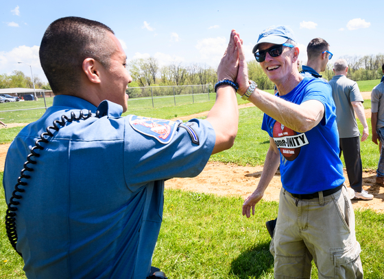 An HCPD officer at a community kickball game.