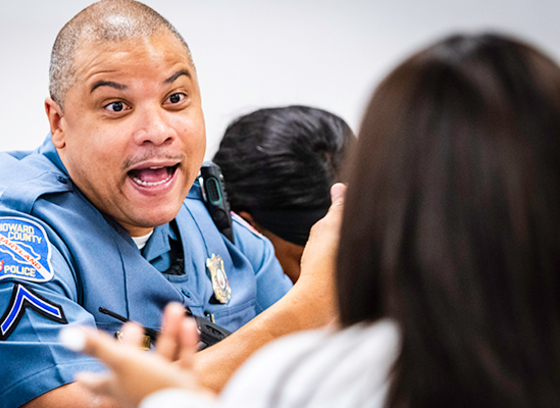 An HCPD school resource officer chats with a student.