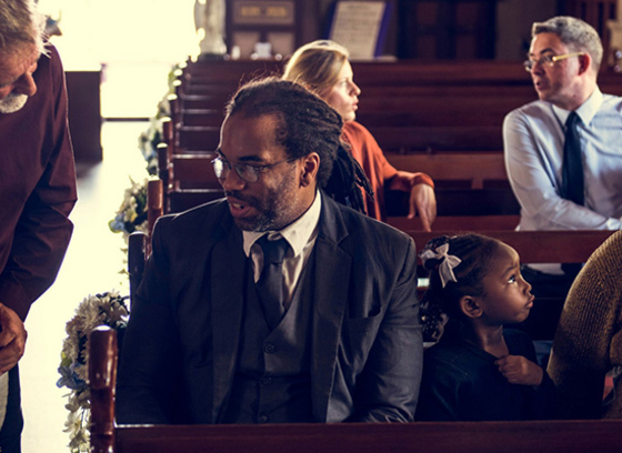 People greeting each other in church