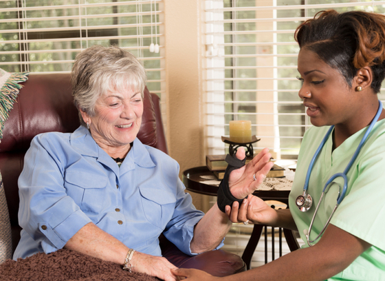 older woman in home with visiting healthcare giver